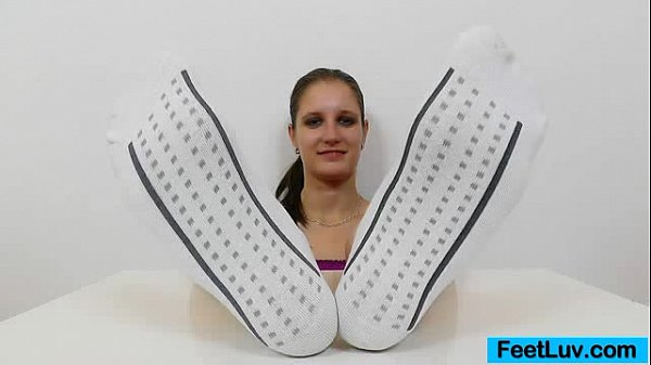 Footjob from a young brunette